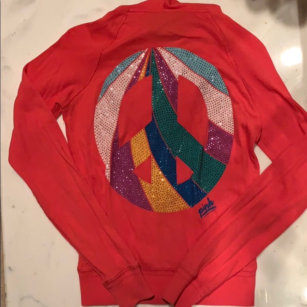 A Pink Victoria’s Secret coral zip up sweatshirt